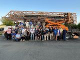 Rally participants pose with Race 15's crane